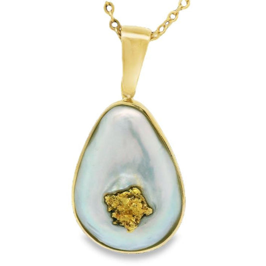 Gold pendant with gold nugget on a white Australian Mabe Pearl